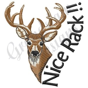 May include: An embroidered design featuring a deer head with large antlers. The deer is rendered in shades of brown and tan, with detailed stitching. The text "Nice Rack!!" is arched around the deer's head in black.