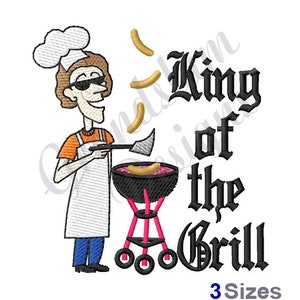 May include: A cartoon illustration of a person wearing a chef's hat and sunglasses grilling hot dogs on a pink grill. The text "King of the Grill" is written in a gothic font.