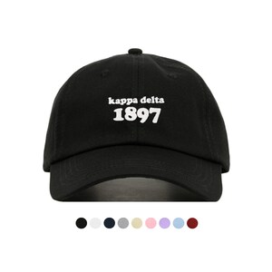 May include: Black baseball cap with white embroidered text "kappa delta 1897".