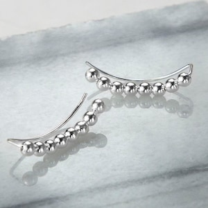 Pendientes trepadores de plata de ley con forma de bola