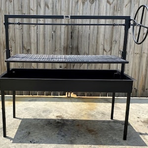 May include: Black metal outdoor grill with a rotating spit and a side shelf. The grill has a rectangular base with four legs and a metal grate.