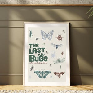May include: A framed art print featuring various insect illustrations in shades of blue, green, and brown. The text "THE LAST OF THE BUGS" is displayed in green, with the phrase "call me when the bugs don't die" below.