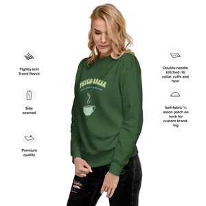 May include: A dark green long-sleeve sweatshirt featuring the text "PHYSIO BREAK" in light green letters above a graphic of a steaming cup. The garment includes a ribbed collar, cuffs, and hem, with side seams and a tightly knit 3-end fleece fabric.
