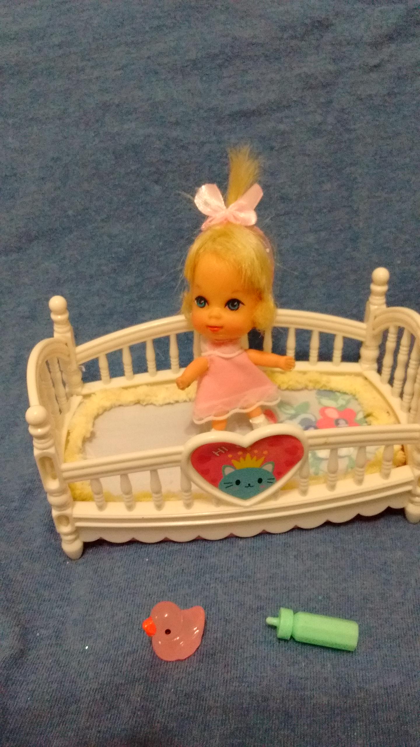 vintage Kiddle baby doll with modern crib and accessories