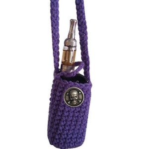 May include: Purple crocheted vape pouch with a skull and crossbones charm. The pouch has a long purple strap for carrying around the neck.