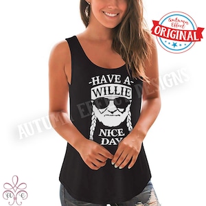 May include: Black vest top featuring a white graphic of a man in sunglasses and braids, with the text "Have a Willie Nice Day". The top has a scoop neck and a curved hem. A red and blue circular logo is in the upper right corner.
