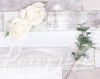Styled Stock Photo with Wooden Background, White Roses and Green Leaves.