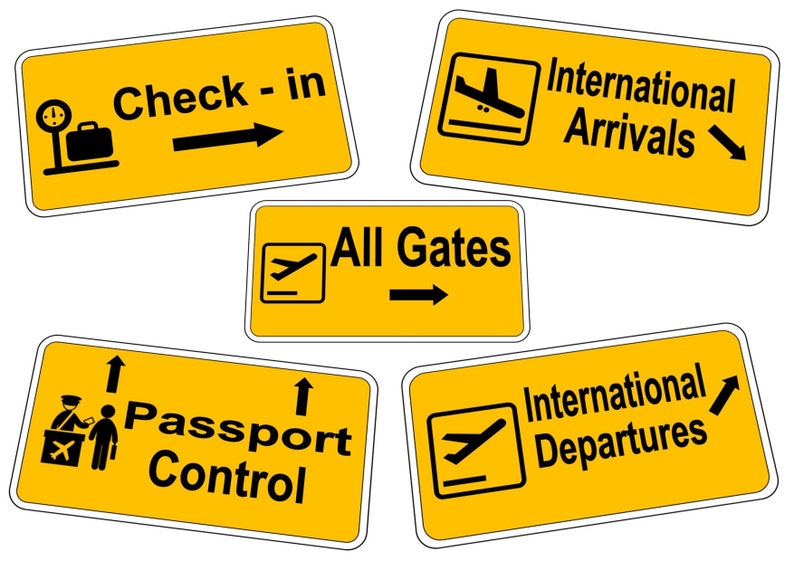 May include: Five yellow airport signs with black text and symbols. The signs read: "Check-in", "International Arrivals", "All Gates", "Passport Control", and "International Departures".
