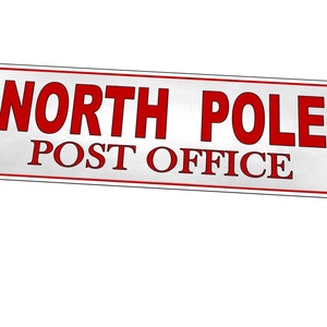 May include: A white metal sign with red text that reads "NORTH POLE POST OFFICE".