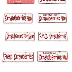 May include: Eight vintage-style signs with red text on a white background advertising strawberries. The signs include phrases like "Fresh Picked Strawberries", "Pick Your Own Strawberries", and "Locally Grown Strawberries".