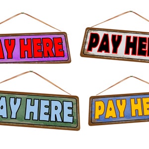 May include: Four vintage-style wooden signs with the text "Pay Here" in different colors. The signs are hanging from strings and have a distressed look.
