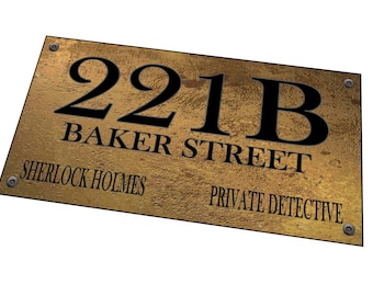 May include: A gold metal sign with black text that reads "221B Baker Street Sherlock Holmes Private Detective".