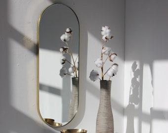 Capsula™ Capsule shaped Modern Mirror with Brass Frame