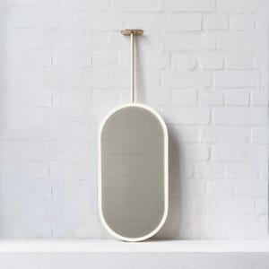 Capsula Ceiling Hanging Suspended Mirror with a Brass Frame and Front Illumination