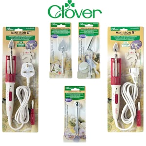 May include: A selection of Clover Mini Iron II and adapter tips for crafting. The irons have red and white handles with a small iron head. The adapter tips include a large iron tip, slim line tip, and ball tip.