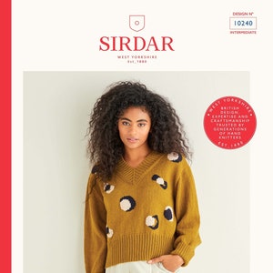 May include: A mustard yellow sweater with a V-neck and a white and black polka dot pattern. The sweater is cropped and has a ribbed hem. The text "COUNTRY CLASSIC 4 PLY" is printed on the bottom of the image. The text "81-137cm 32-54in MORE COLOURS ON BACK PAGE" is also printed on the image.