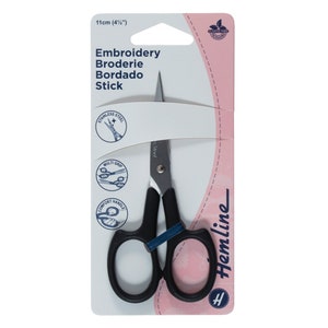 May include: Black embroidery scissors with a 11cm blade, packaged on a white and pink card with the text "Embroidery Broderie Bordado Stick" and "Hemline".
