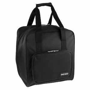 May include: Black sewing machine carrying case with a zippered pocket and a "Hobby Gift" label.