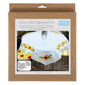 May include: A cross stitch tablecloth kit in a cardboard box. The kit includes a white tablecloth with embroidered sunflowers. The tablecloth measures 31.5 x 31.5 inches. The box has text in multiple languages.