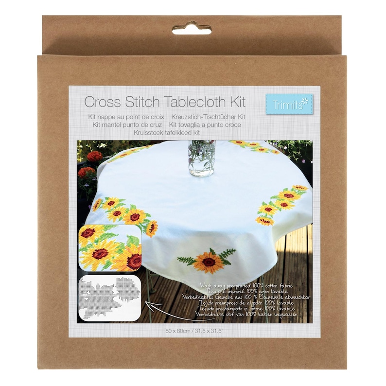 May include: A cross stitch tablecloth kit in a cardboard box. The kit includes a white tablecloth with embroidered sunflowers. The tablecloth measures 31.5 x 31.5 inches. The box has text in multiple languages.