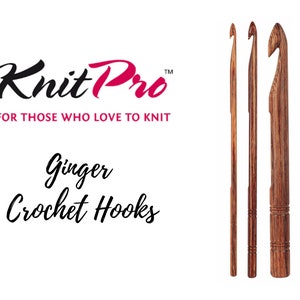 May include: Three wooden crochet hooks in different sizes. The hooks are brown and have a natural wood finish. The hooks are labelled "Knit Pro" and "Ginger Crochet Hooks".