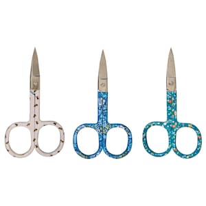 May include: Three small, decorative scissors with stainless steel blades. The handles feature unique patterns: one with bees, another with a blue floral design, and the third with a teal floral pattern. The scissors are designed for detailed crafting or trimming.