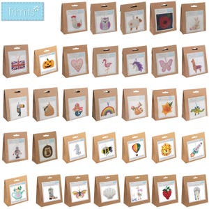 May include: A collection of craft kits in brown paper bags, each featuring a different embroidered design. Designs include a chicken, owl, sheep, poppy, rabbit, Union Jack, pumpkin, heart, flamingo, unicorn, butterfly, and more.