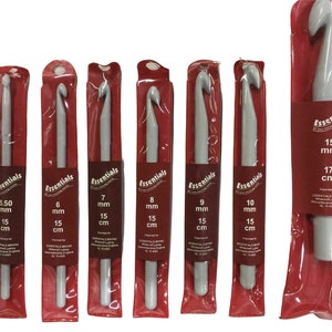 May include: Set of 7 grey crochet hooks in individual plastic packaging. The hooks are labelled with their size in millimetres and centimetres. The packaging is red with the word "Essentials" printed on it.