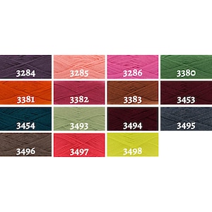 May include: A colour chart of yarn samples in various shades of purple, pink, green, orange, red, brown, teal, grey, beige, and yellow. The yarn samples are labelled with numbers.