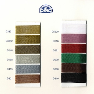 May include: DMC embroidery floss color chart with 10 different colors of floss. The colors are: gold, white, pink, red, green, brown, black, silver, gray, and copper.