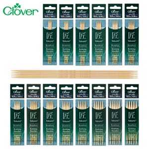 May include: A selection of Clover Takumi bamboo knitting needles in various sizes, from 2.0mm to 6.5mm. The needles are packaged in green and white sleeves. The image also shows individual needles.