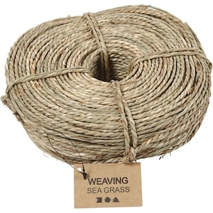 May include: A roll of natural seagrass twine, ideal for weaving and crafting projects. The twine is beige and has a natural, rustic look. The label reads "Weaving Sea Grass".