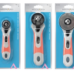 May include: Three rotary cutters in different sizes, 20 mm, 45 mm, and 60 mm, with a white and orange handle. The cutters are packaged in clear plastic with blue backgrounds and the MILWARD brand name.