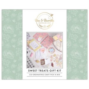 May include: A craft kit with a pink and white floral design. The kit includes a variety of paper, embellishments, and other supplies for creating cards, scrapbook pages, and other crafts. The kit is labeled "Sweet Treats Gift Kit" and "Co-ordinating Craft Pick N Mix".