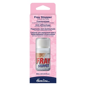 May include: A pink and white bottle of Fray Stopper fabric sealant. The bottle is labelled with the product name and instructions in multiple languages. The bottle is 60 ml (2.03 fl. oz.).