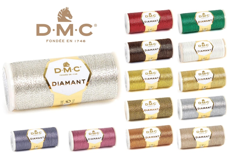 May include: A collection of DMC Diamant metallic embroidery floss spools in various colors, including silver, gold, red, green, brown, and more. The spools are labeled with the DMC logo and the text "Diamant".