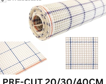 May include: A roll of white Aida cloth with blue and red lines, pre-cut in 20, 30, and 40 cm sizes.  The cloth is used for cross-stitch and needlepoint projects.