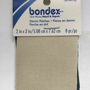 May include: A pack of 8 beige denim patches for mending and repairing clothes. The patches are 5.08 cm by 7.62 cm and are made of a woven fabric. The packaging says "bondex. Save Money Mend & Repair™ Denim Patches • Piéces en denim Parche en dril 2 in x 3 in/5.08 cm x 7.62 cm 8 pc/pz"