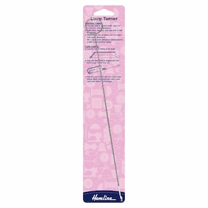 May include: A silver loop turner tool for turning fabric loops. The tool is on a pink and white packaging card with instructions on how to use the tool. The packaging card has the text "Loop Turner" at the top.