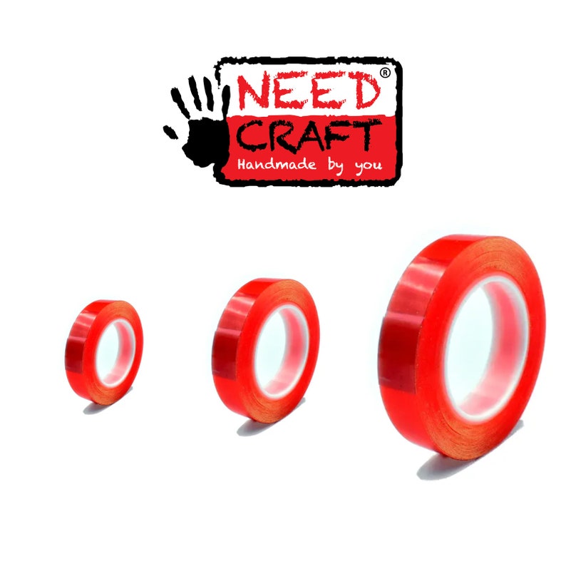 May include: Three rolls of red double-sided adhesive tape. The tape is clear with a red backing. The rolls are different sizes.