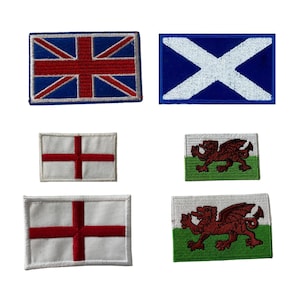 May include: Six embroidered patches featuring the flags of England, Scotland, Wales, and the United Kingdom. The patches are all rectangular and have a white background with red, blue, and green accents.