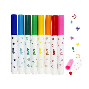 May include: A set of eight colorful markers with blue, light blue, green, yellow, orange, red, and pink caps. The white barrels are decorated with various symbols and the word "Arti". Two markers are uncapped, showing the red ink.