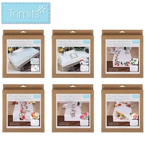 May include: Six boxed embroidery table runner kits. Each kit features a different floral design, with images of the finished runners displayed on the front. The boxes are brown with a blue label that says "Trimits".