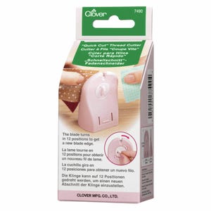 May include: A light pink Clover Quick Cut thread cutter in its retail packaging. The device features a rotating blade with 12 positions for a fresh edge. The packaging displays the product name, instructions, and a diagram showing the blade rotation.