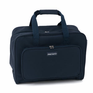 May include: A dark blue sewing machine carrying case with a zipper closure and a white label that says "Hobby Gift".