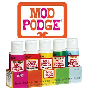 May include: A Mod Podge starter pack with five 59 ml bottles of craft glue in different finishes: Sparkle, Gloss-Lustre, Matte-Mat, Outdoor, and Paper. The Mod Podge logo is displayed above the bottles in an orange and pink design.
