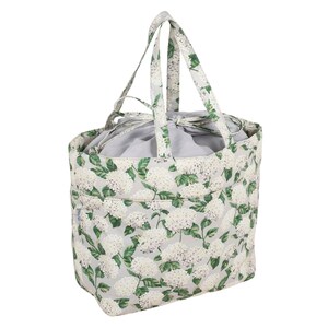 May include: A white and green floral tote bag with a drawstring closure and two handles. The bag is made of a sturdy fabric and has a floral pattern.