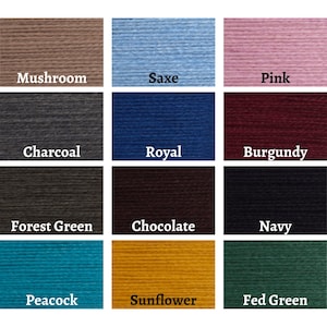 May include: A color chart featuring swatches of yarn in various shades. Colors include Mushroom, Saxe, Pink, Charcoal, Royal, Burgundy, Forest Green, Chocolate, Navy, Peacock, Sunflower, and Fed Green. Each color is labeled with its name.