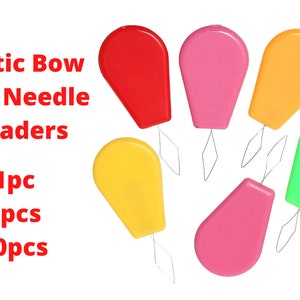 May include: Plastic bow wire needle threaders in red, pink, orange, yellow, and green. The text "Plastic Bow Wire Needle Treaders" and "1pc 3pcs 10pcs" is visible in the image.