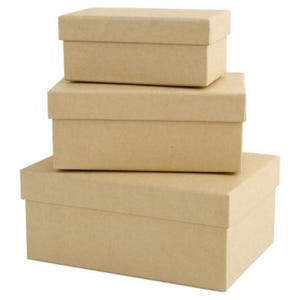May include: Three rectangular cardboard boxes, stacked. The boxes are a light brown colour and have separate lids. The boxes are arranged in descending size, with the smallest on top.
